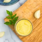 a jar of garlic paste with clo