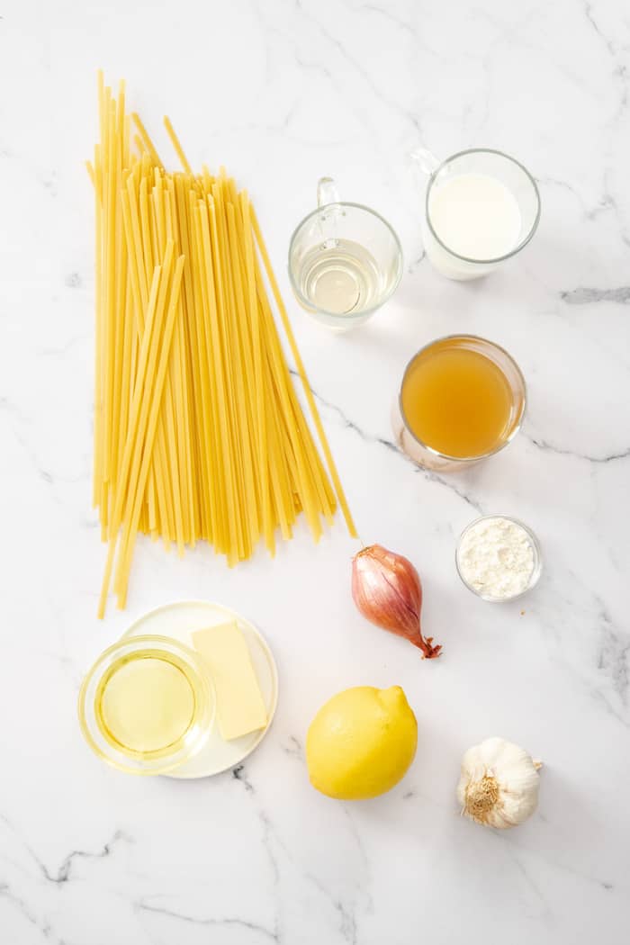 dried fettuccine, shallot, butter, lemon, and other ingredients on a white board.