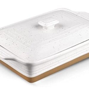 a white speckled baking dish with a brown bottom