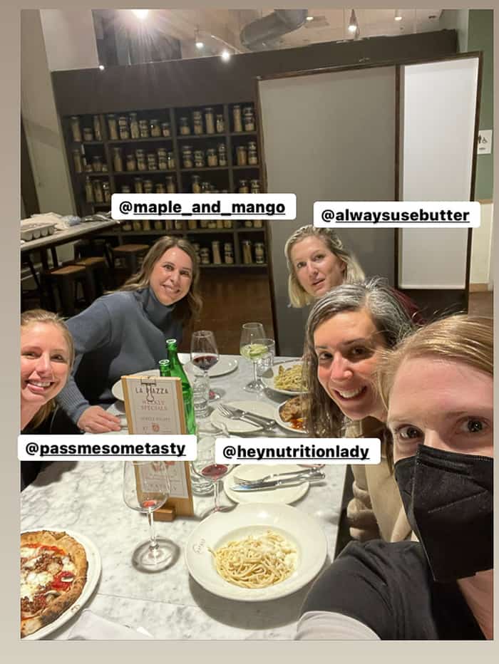 5 women at a restaurant with food on the table