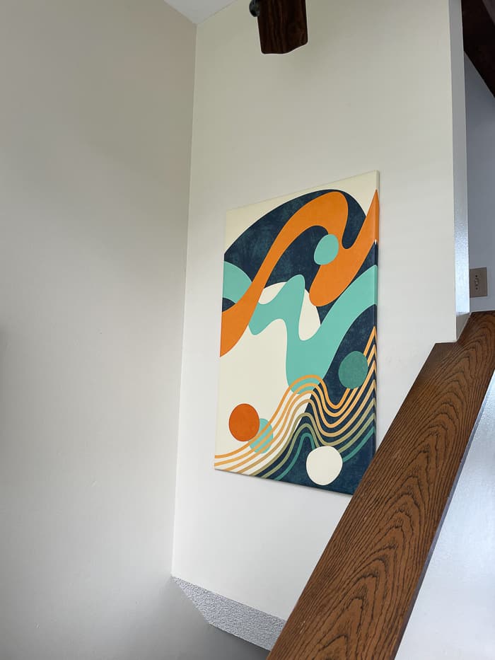 a colorful painting hanging on a wall