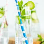 2 glasses and a pitcher full of cucumber mint water.