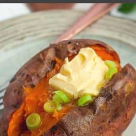 a whole air fryer roasted sweet potato topped with butter and green onions.