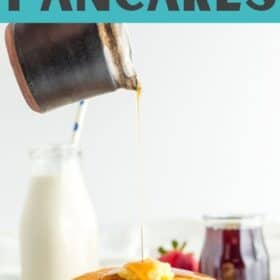 a stack of oatmilk pancakes on a plate with syrup being poured over it.