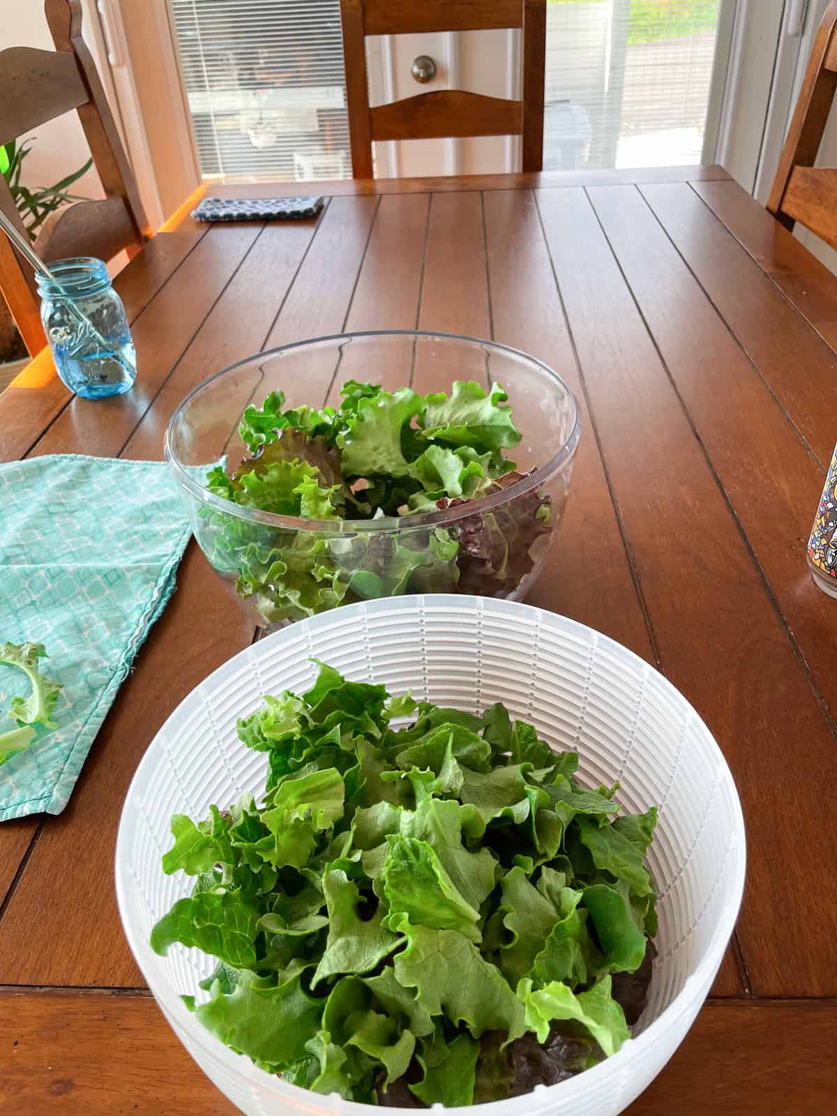 a basket of lettuce on a table.