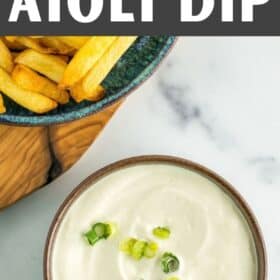 vegan mayonnaise dip in a bowl with a plate of french fries