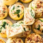 a tray of Instant Pot egg bites with spinach and chopped bacon..