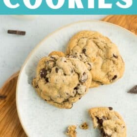 crumbled cookies on a grey plate with chocolate chunks.