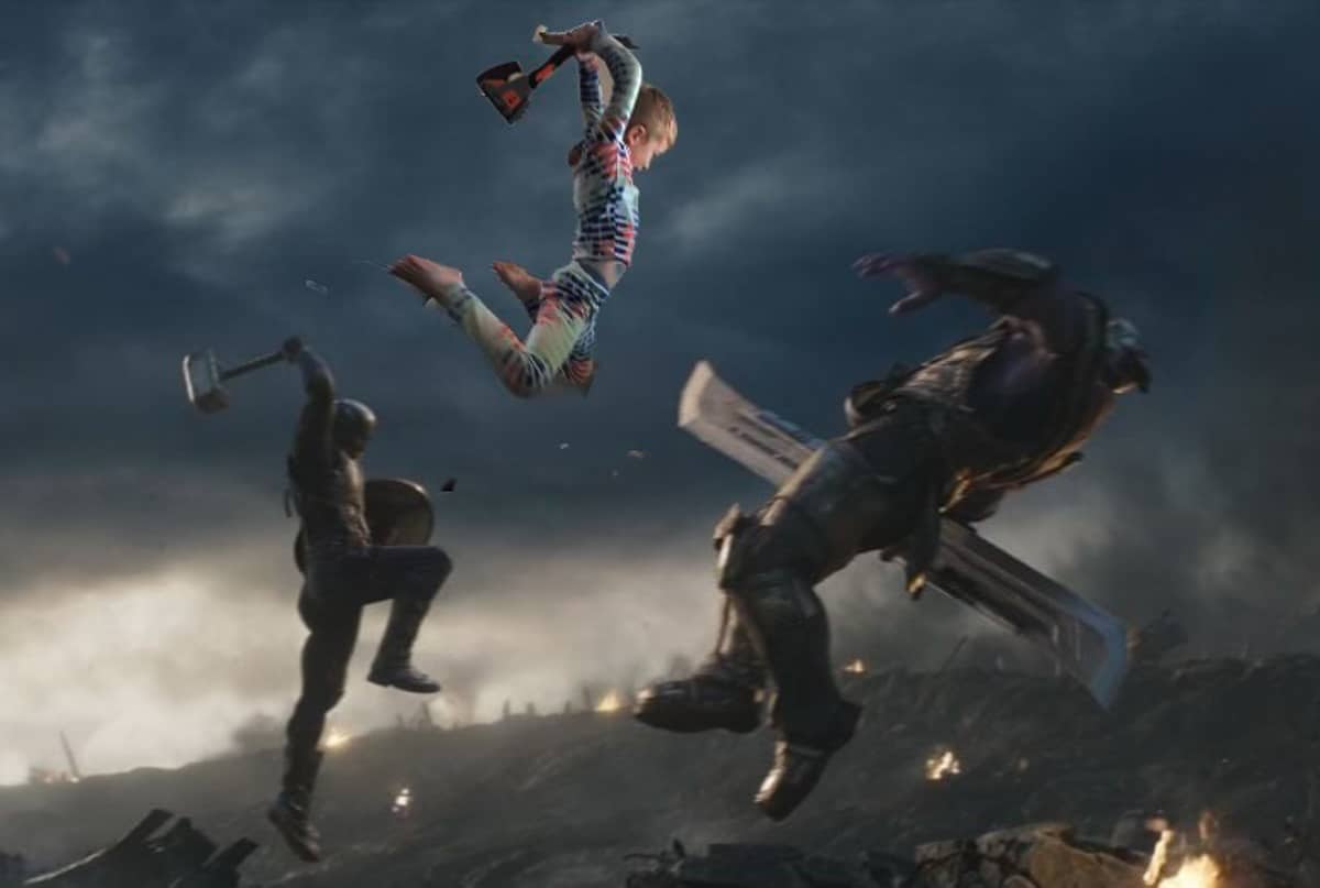 a fake Marvel photo of a little boy attacking Thanos.