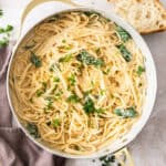 a white skillet with Boursin pasta topped with parsley.