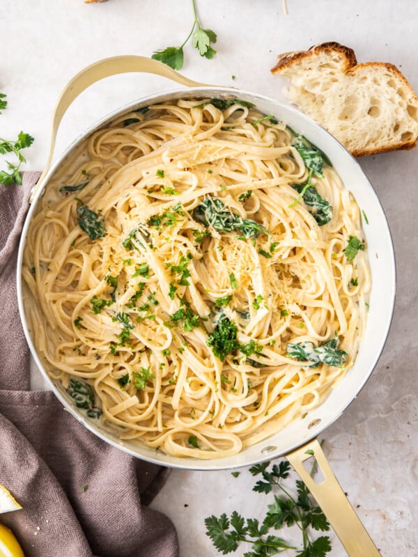 a white skillet with Boursin pasta topped with parsley.