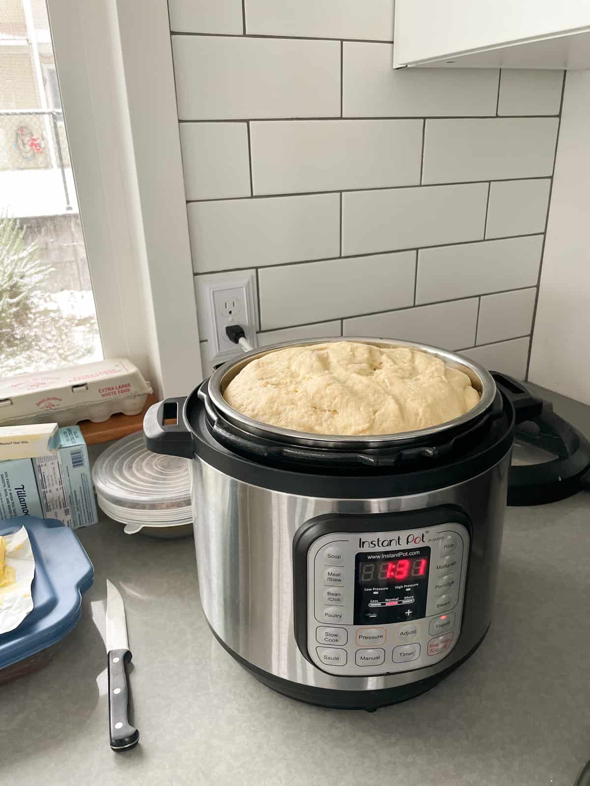 dough rising over the top of an Instant Pot.