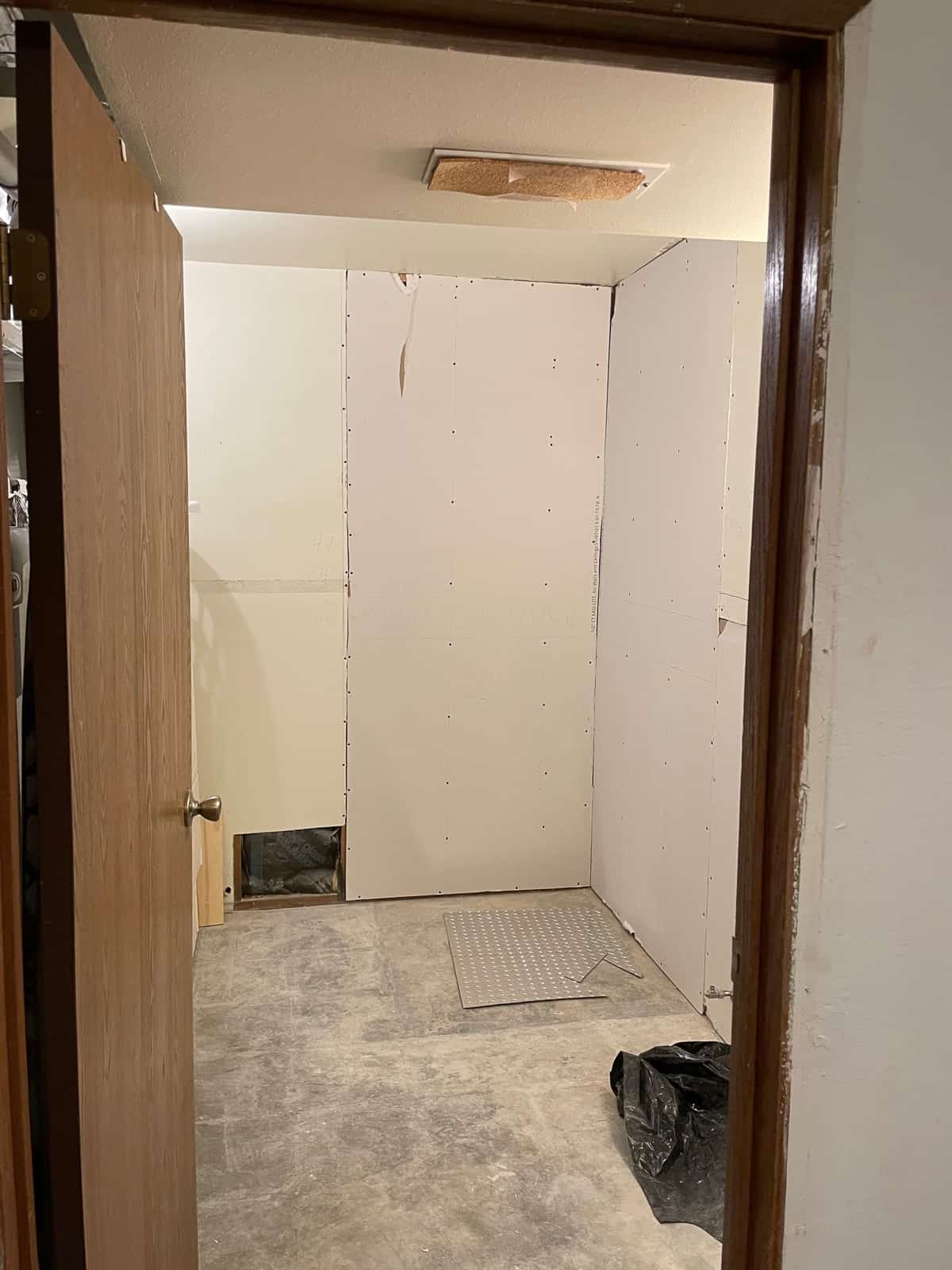 a laundry room with drywall.