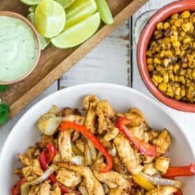 sliced air fryer chicken fajitas with peppers.