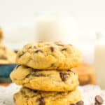 3 chocolate chip cookies without brown sugar that are on a white plate with 3 chocolate chips.