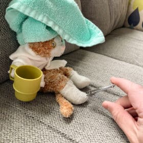 a stuffed kitty with a towel on its head.