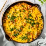 an overhead photo of chicken and rice casserole topped with cilantro.