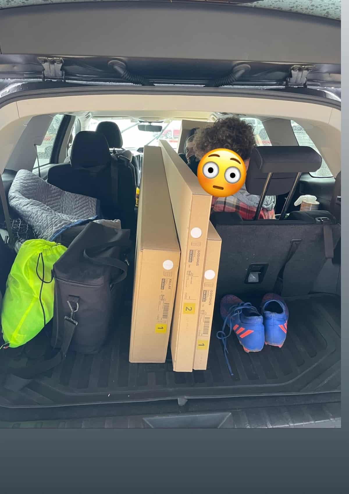 a car full of IKEA boxes.