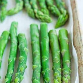 frozen asparagus spears on a tray.