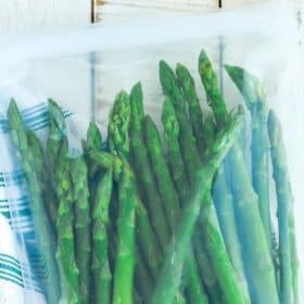frozen asparagus spears in a silicone bag.