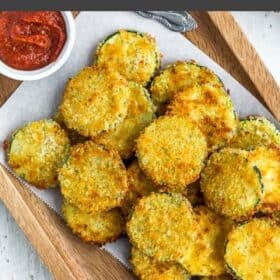 a wooden dish of breaded air fryer zucchini chips.