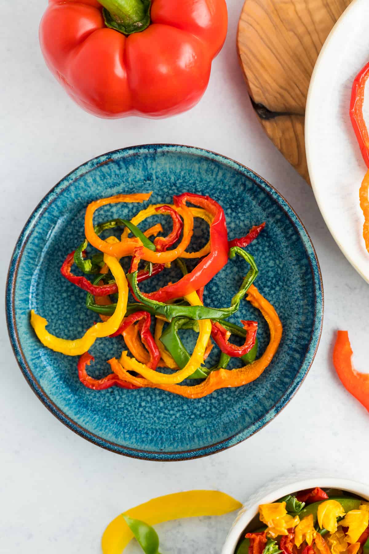 a blue plate with sliced peppers.