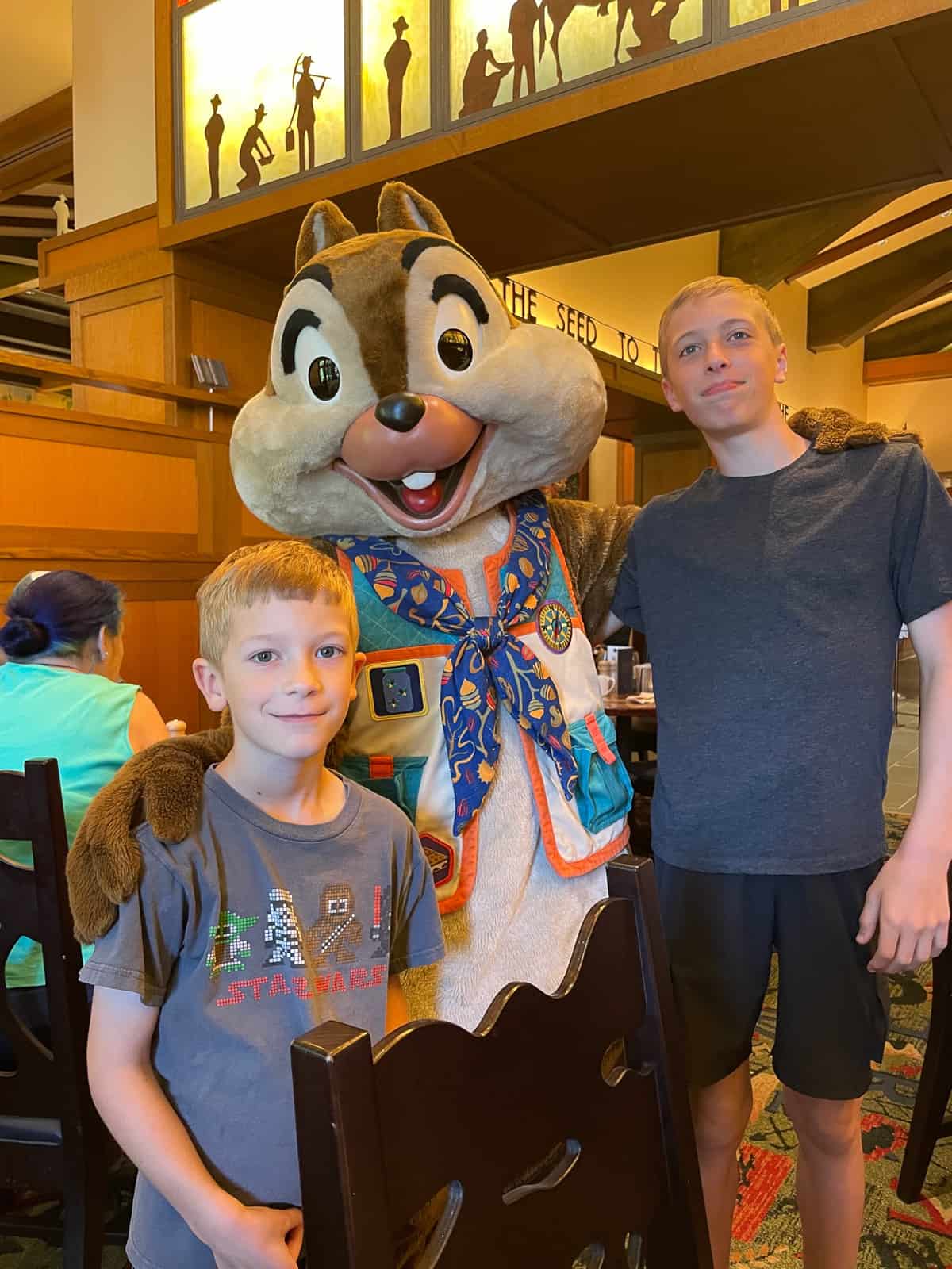 two boys with a Disney character.