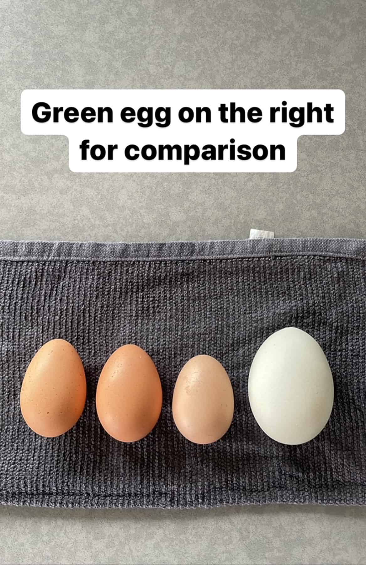 4 eggs on a grey cloth.
