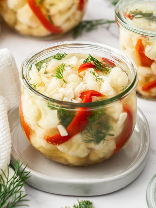 a weck jar of pickled cauliflower, red peppers, and dill.