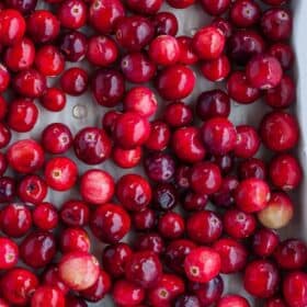 fresh cranberries on a baking tray.