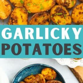 Roasted garlic potatoes on a baking sheet topped with chopped parsley.
