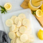 a silicone bag with frozen lemons and a glass of lemonade.