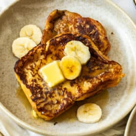 french toast on a beige plate.