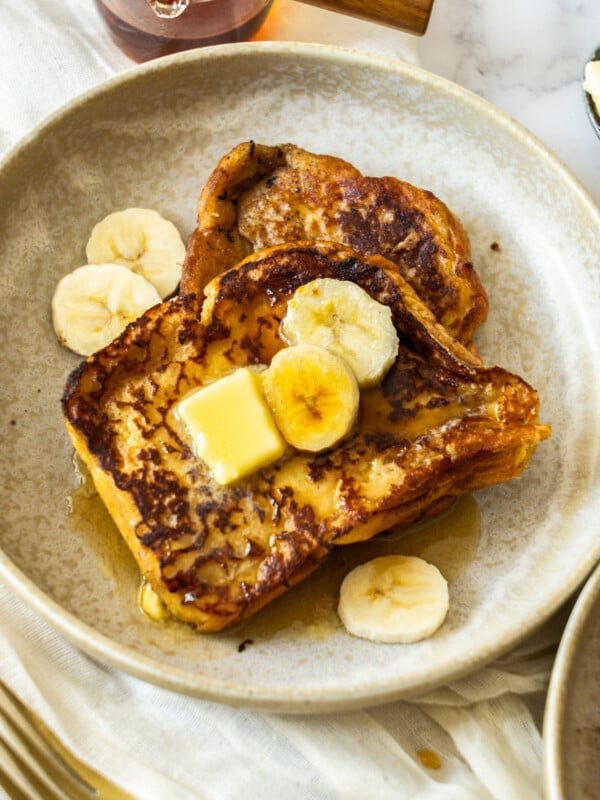 french toast on a beige plate.