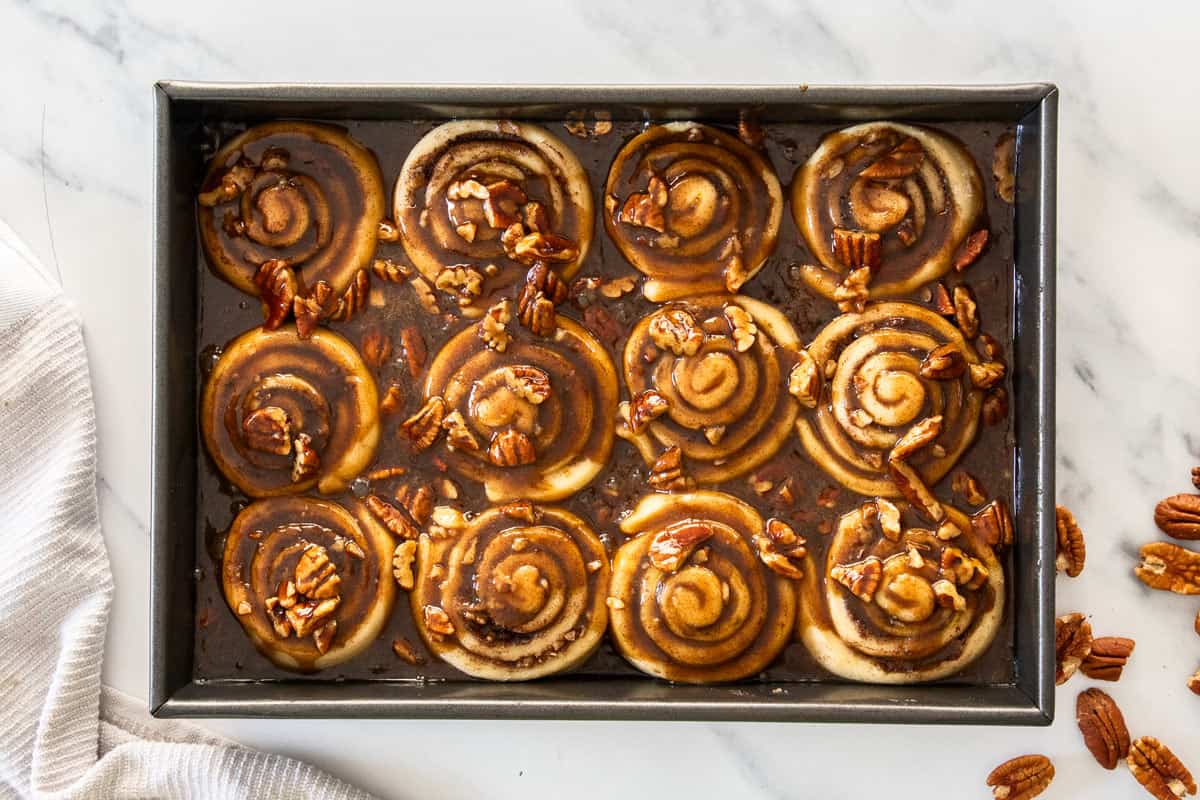 a pan of unbaked pecan sticky buns.