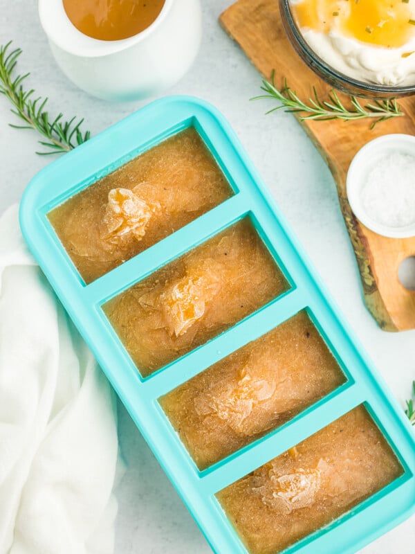 a teal freezer tray with frozen gravy.