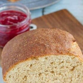 A portion of a loaf of honey whole wheat bread.