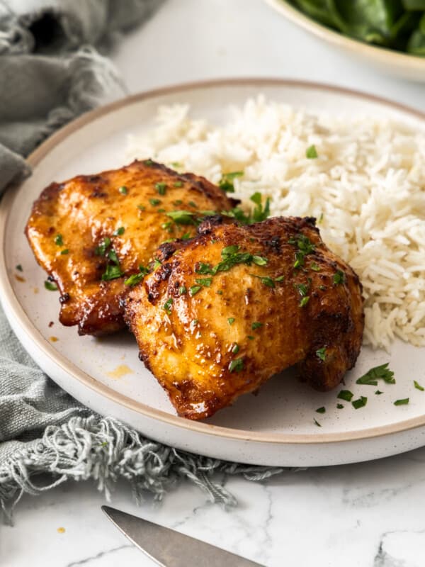 air fryer boneless chicken thighs on a bed of rice.