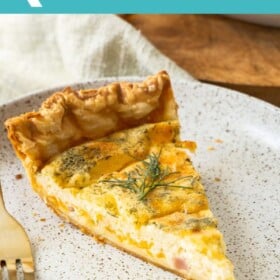 a slice of quiche on a plate with a golf fork.
