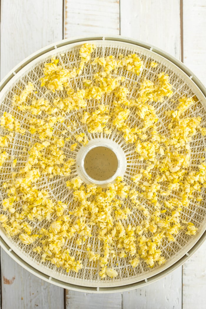 minced garlic on a dehydrator tray.
