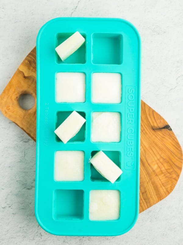 frozen cubes of buttermilk in a teal silicone tray.