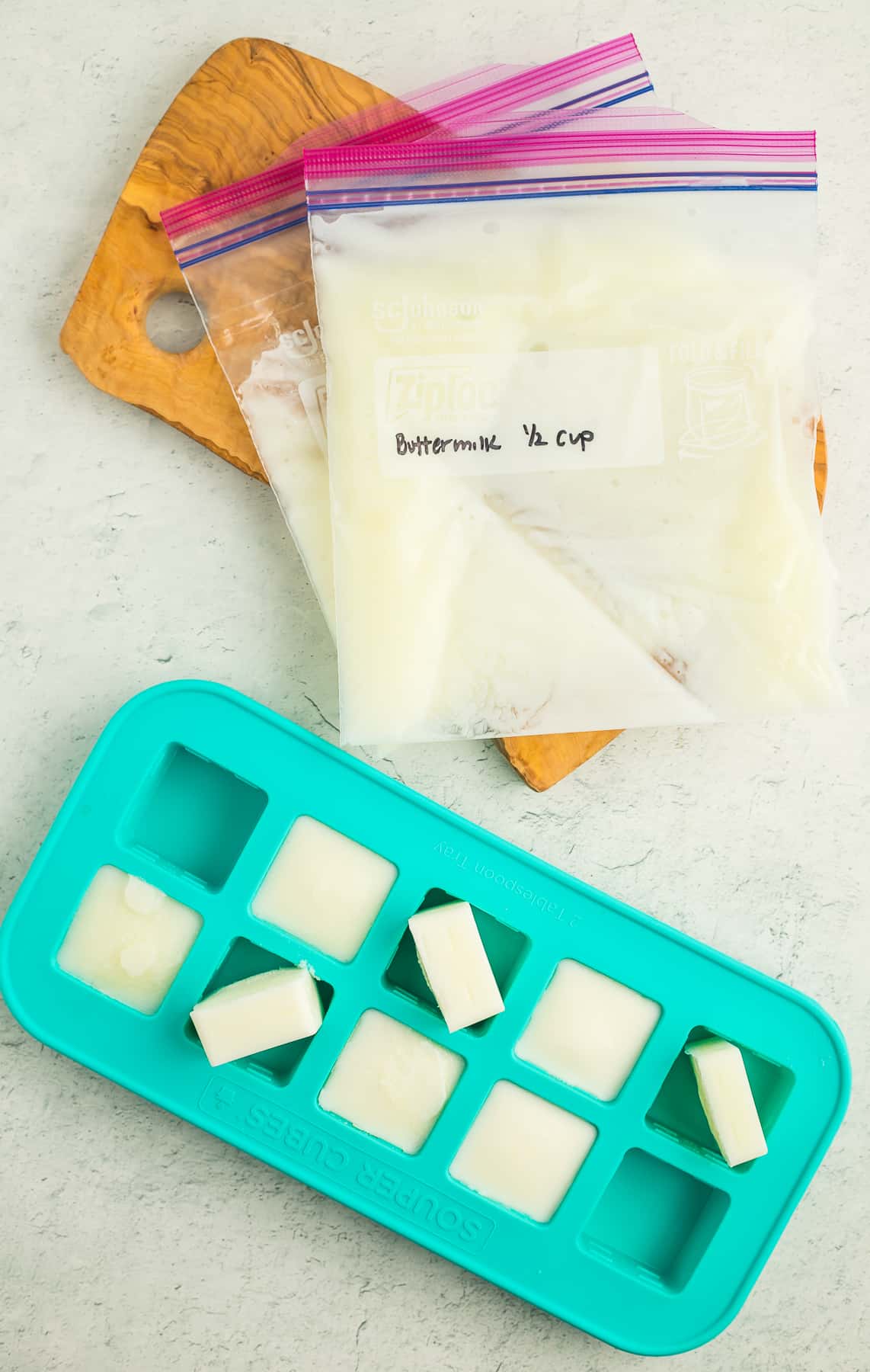 frozen buttermilk in a silicone tray and small plastic ziplocs.