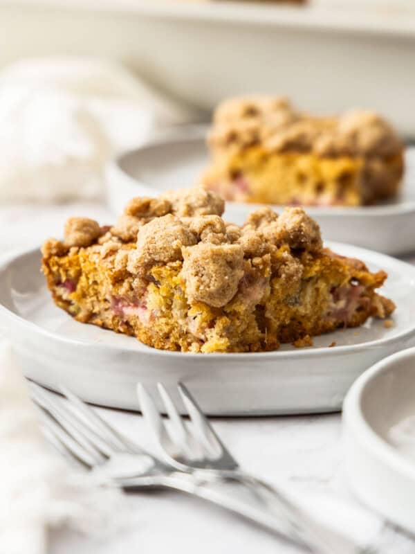 a serving of rhubarb cake on a white plate.