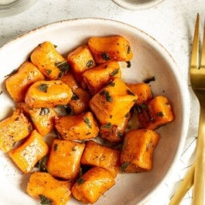 a white plate with sweet potato gnocchi.