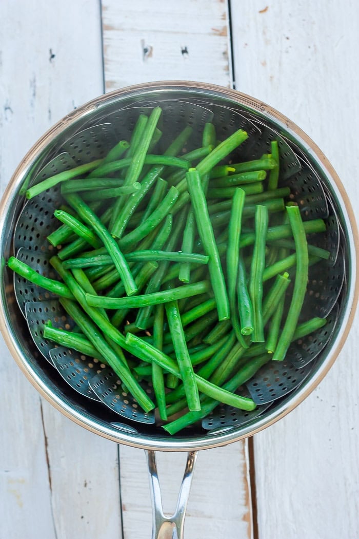 steamed green beans in a saucepan.