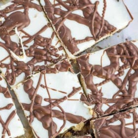 pieces of s'mores bark on a baking sheet.