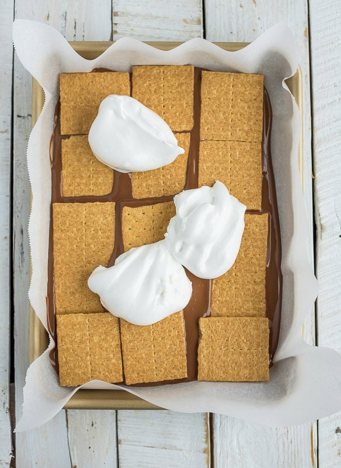 marshmallow creme on top of graham crackers and melted chocolate.