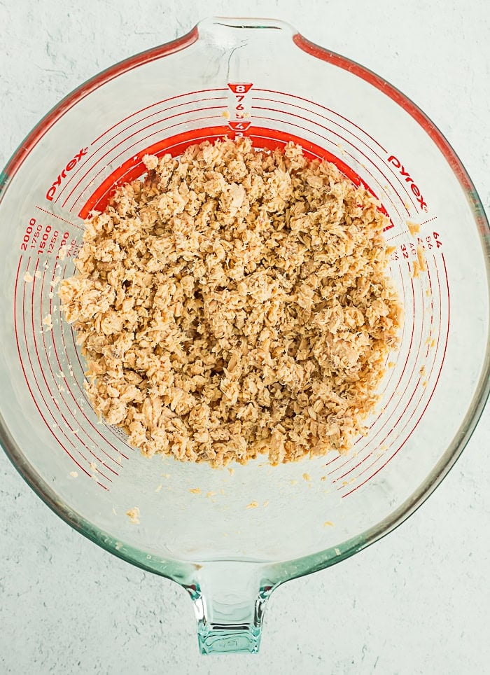 crumbled ingredients in a glass bowl.