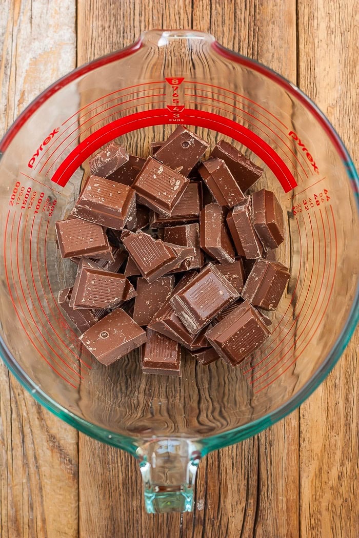 a glass bowl of cubed chocolate.