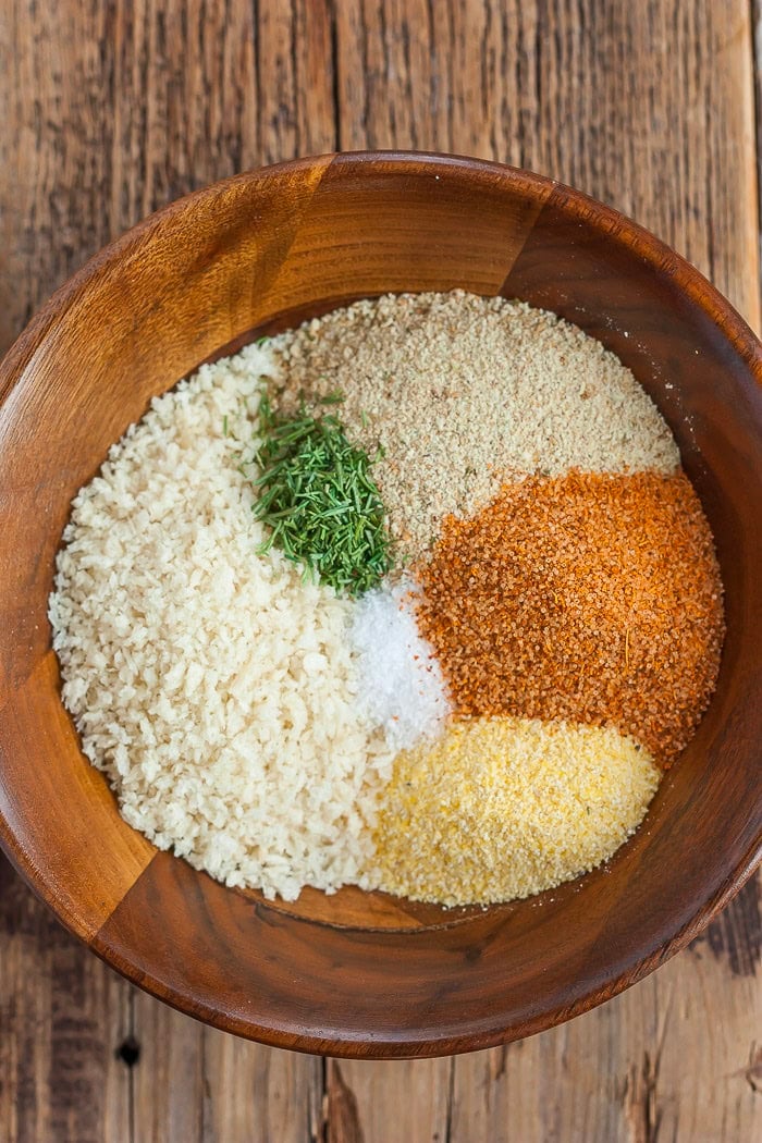 a bowl of breading and seasoning.